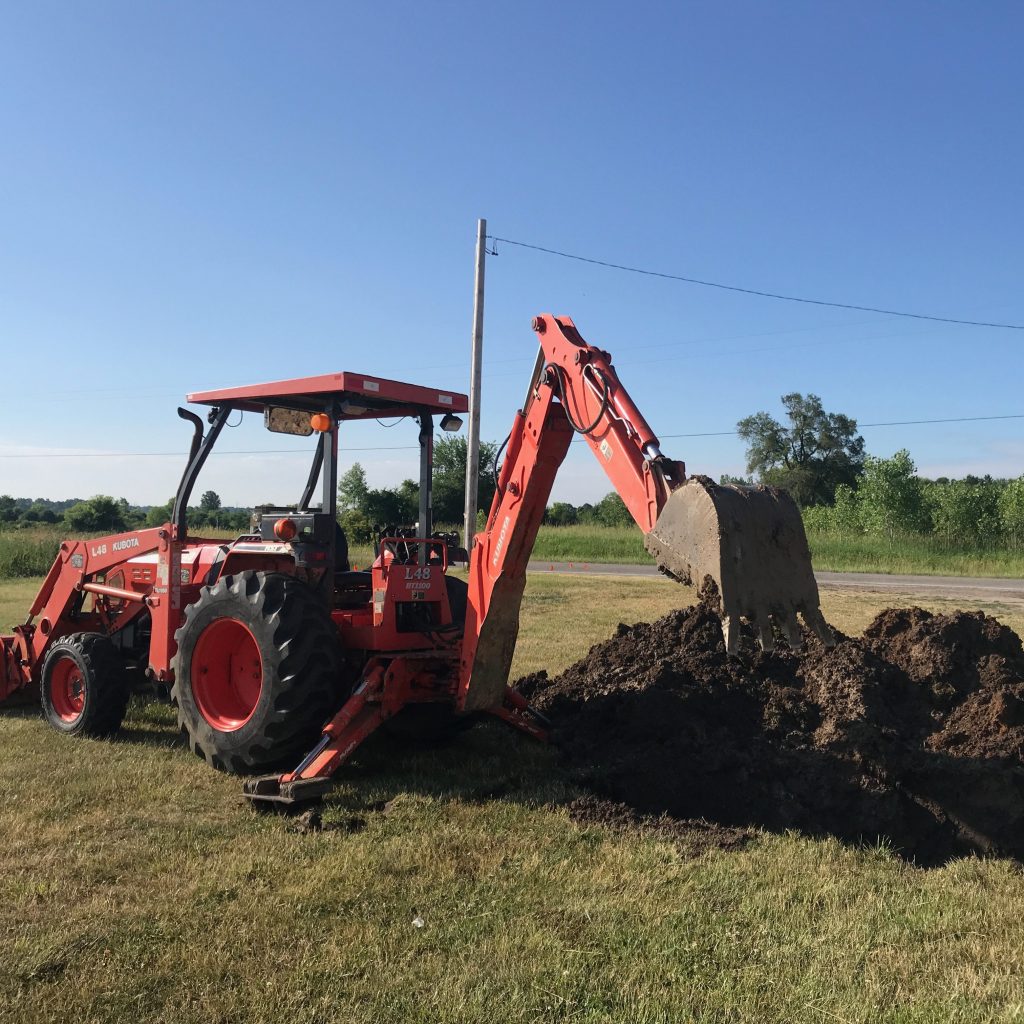 excavating central Michigan cm backhoe service